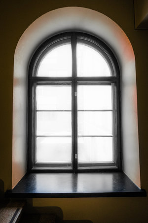 Arched Window with Bright White Light Shining Throughの写真素材