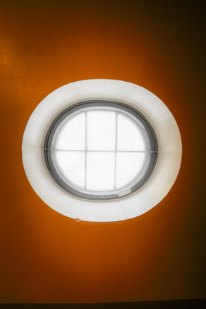 Round Window with Bright White Light Shining Throughの写真素材