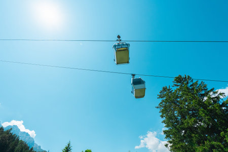 Cable Car Gondola Cabins VIewed from Bottom Up on a Hot Sunny Summer Day