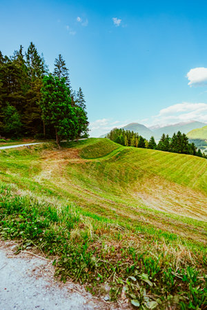 Beautiful Green Hillside Field near a Hiking Pathの写真素材