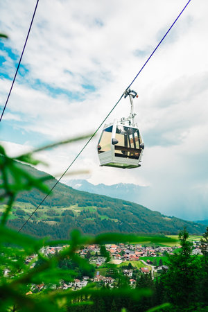 Cable Car Cabin Driving Down in a Mountain Landscape with Aerial Viewの写真素材