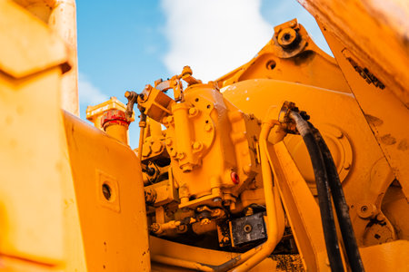 Heavy Machinery Motor Engine Part of a Yellow Excavatorの写真素材