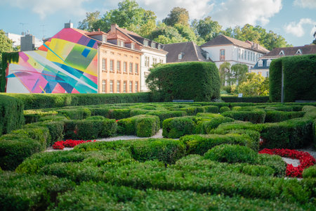 Beautiful Park Gardening and Landscaping of Green Bushes Common Box in the City on a Bright Sunny Spring Dayの写真素材