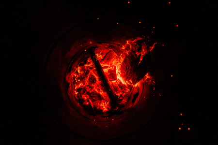 Glowing and Flaming Wood with Ember in a Barrel