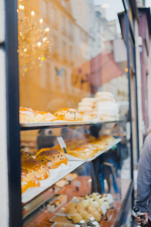 Window Shopping Display of a Bakery Presenting their Delicious Dessert Cakes to the Publicの写真素材