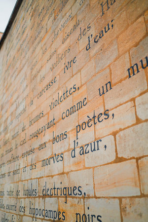 Ancient Sanskrit Written on a Sandstone Momorial Wallの写真素材