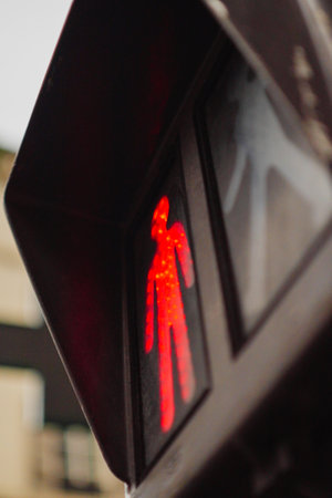 Red Pedestrian Traffic Light Signing to Stop in Paris Franceの写真素材