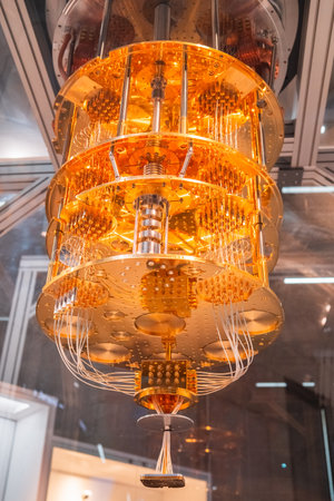 Detailed image showcasing a quantum computer processor with complex gold wiring and components, highlighting advanced technology in a modern laboratory setting.の写真素材