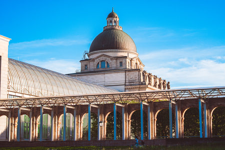 Stunning dome structure of historic Munich architecture, showcasing classic design elements under a clear blue sky, creating a serene urban landscape.の写真素材