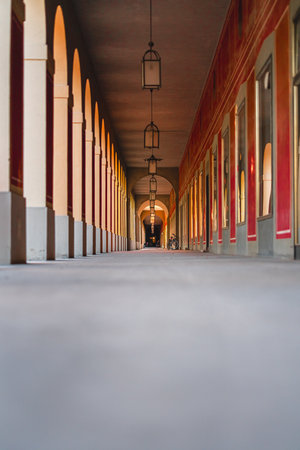 Captivating corridor featuring elegant arches, warm lighting, and an inviting atmosphere. This architectural marvel shows symmetry, and tranquility, with traditional design elements and craftsmanship.の写真素材