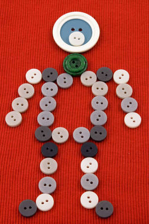 Figure of person consisting of clothing buttonsの写真素材