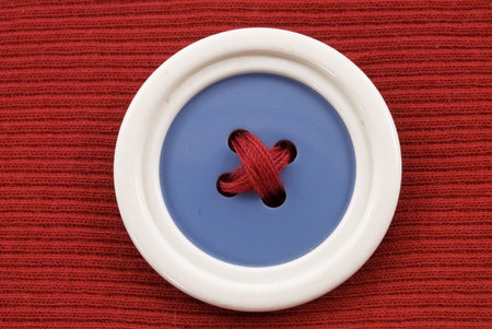 Blue button with white Qaim a red backgroundの写真素材