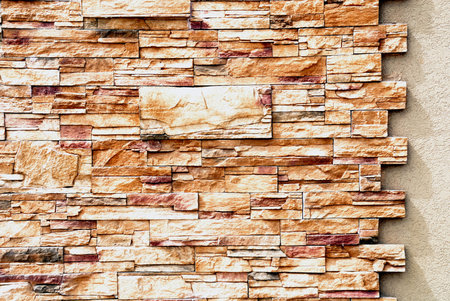 	Fragmet decorative stone walls of an apartment houseの写真素材