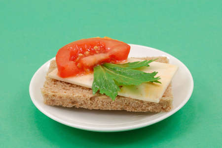 Buterbrob with Mexican cheese, slice tomatoes and green leaves of parsleyの写真素材