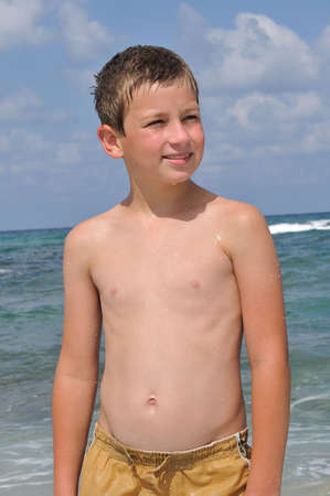 
	 	
A boy poses for a photographer to the seaの写真素材