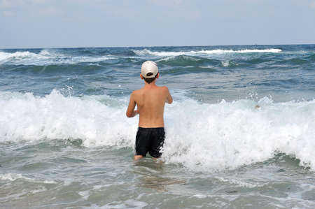 Boy are afraid to go to sea by stormsの写真素材