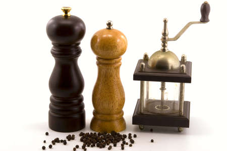 Mills, spices of different kinds photographed in front of white background の写真素材