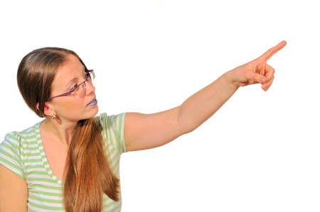 The girl points a finger somewhere maybe on your favorite thing in the shop window の写真素材