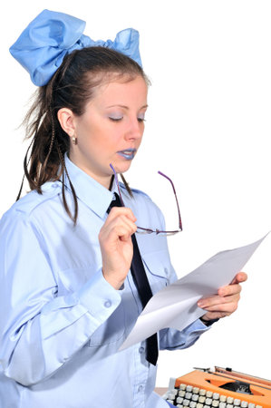 Girl typist carefully read any document in his handsの写真素材