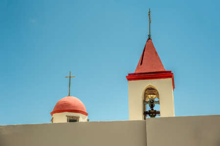 Domes of the church bell, hidden behind a high wall of the monasteryの写真素材