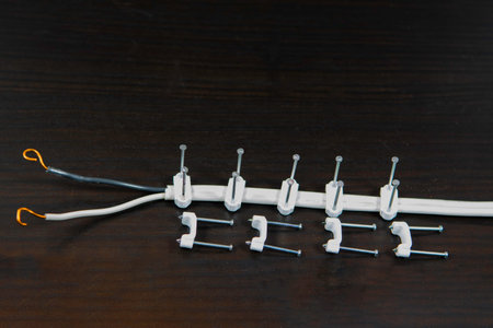 Clips with two nails for fastening, no damage, electrical wires