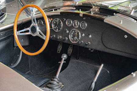 Fragment of the cockpit of a retro car with a steering wheel and instrumentsの写真素材