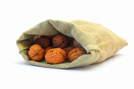 walnuts in a bag on white backgroundの写真素材
