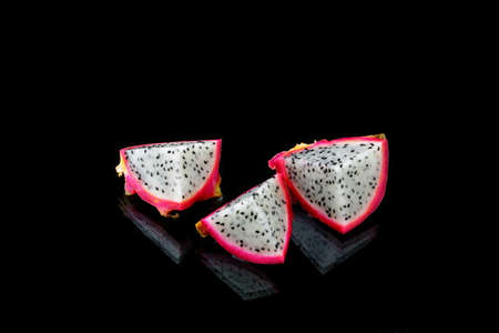 three dragon fruit fritter on black backgroundの写真素材