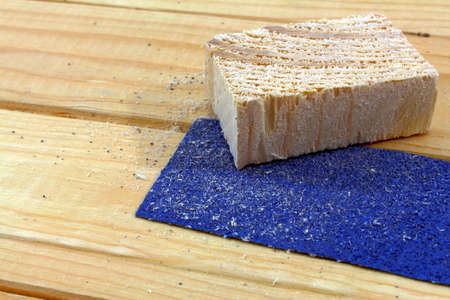 a piece of wood with sandpaper on woodの写真素材