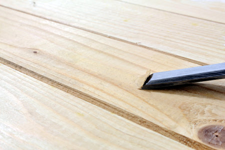 metal planer on wood boards