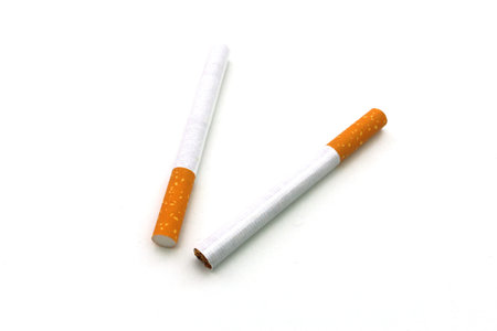 Two cigarettes on white background