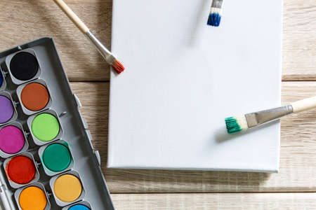 Brushes and malkasts on wooden backgroundの写真素材