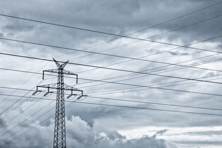 An electricity mast on dark clouds