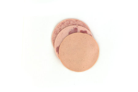 Various sausages slices on a white background