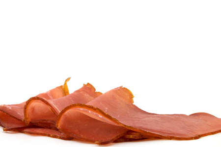 Slices salmon ham on a white backgroundの写真素材