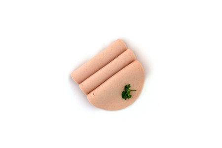 Three slices of mortadella on a white backgroundの写真素材