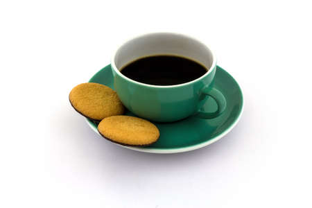 A cup of coffee with cookies on a white backgroundの写真素材