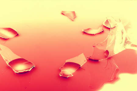 a broken wine glass on a white backgroundの写真素材