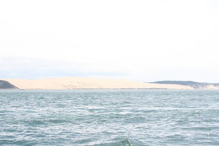 Dune du Pilat in Arcachon seen from afar from the basinの写真素材