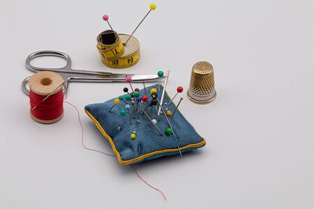 Sewing items, bobbins, thread, needles, scissorsの写真素材