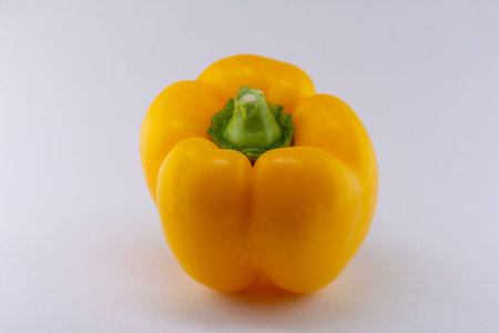 Yellow peppers on a white background