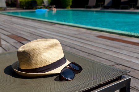 sunglasses and white sunhat.