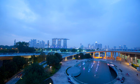 Panorama of Singapore skyline illuminated in the evening twilight