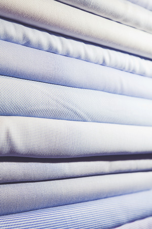 men's shirts folded and stackedの写真素材