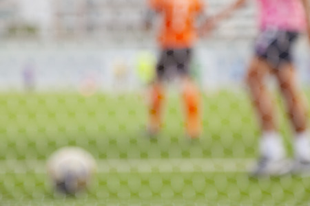blurred image of football field and goal netの写真素材