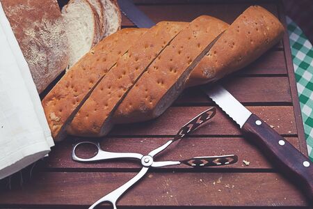 Sliced bread on wood plateの写真素材