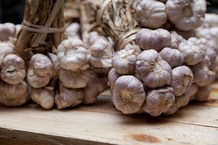 Garlic on wood tableの写真素材
