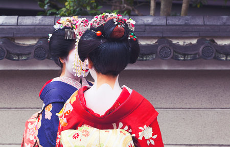 Apprentice geisha,Maiko couple walking in Kyoto, Japanのeditorial素材