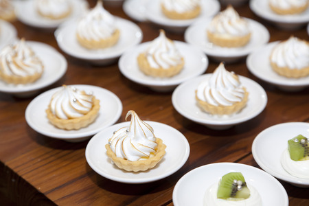 Different kinds of beautiful pastry, small colorful sweet macaronの写真素材