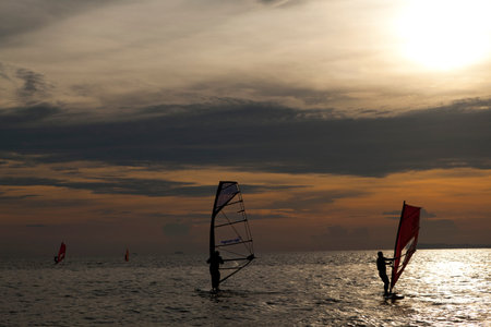 windsurfers enjoy surfing at Jomtien Beach, Pattaya, Thailandのeditorial素材